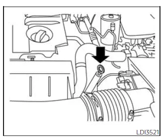 Nissan Frontier engine oil dipstick location and correct checking procedure