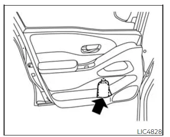 Nissan Frontier front row bottle holders located in door panels