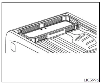 Nissan Frontier cargo carrier installed in truck bed for transporting goods