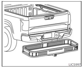 Nissan Frontier cargo carrier mounted on towing hitch for additional storage