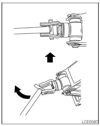 Nissan Frontier jack positioned correctly under frame before lifting vehicle