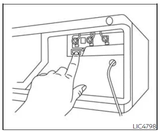 Nissan Frontier HomeLink programming example showing Learn button on garage motor unit