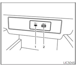 Nissan Frontier front USB charging ports located below climate controls in media pocket