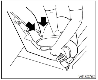 Nissan Frontier tightening child seat by compressing seat cushion step 5